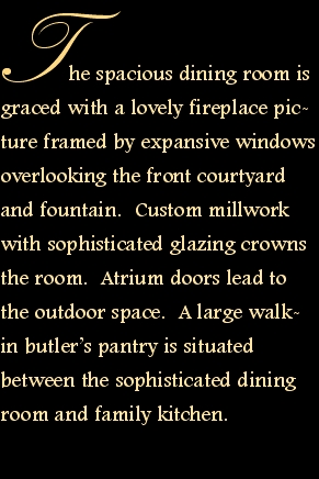 The spacious dining room is graced with a lovely fireplace pict