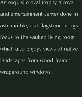 An exquisite oval trophy alcove and entertainment center done i